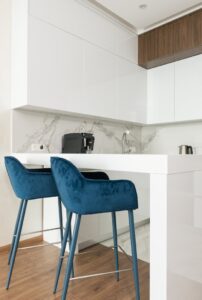 Interior of modern kitchen with table and chairs